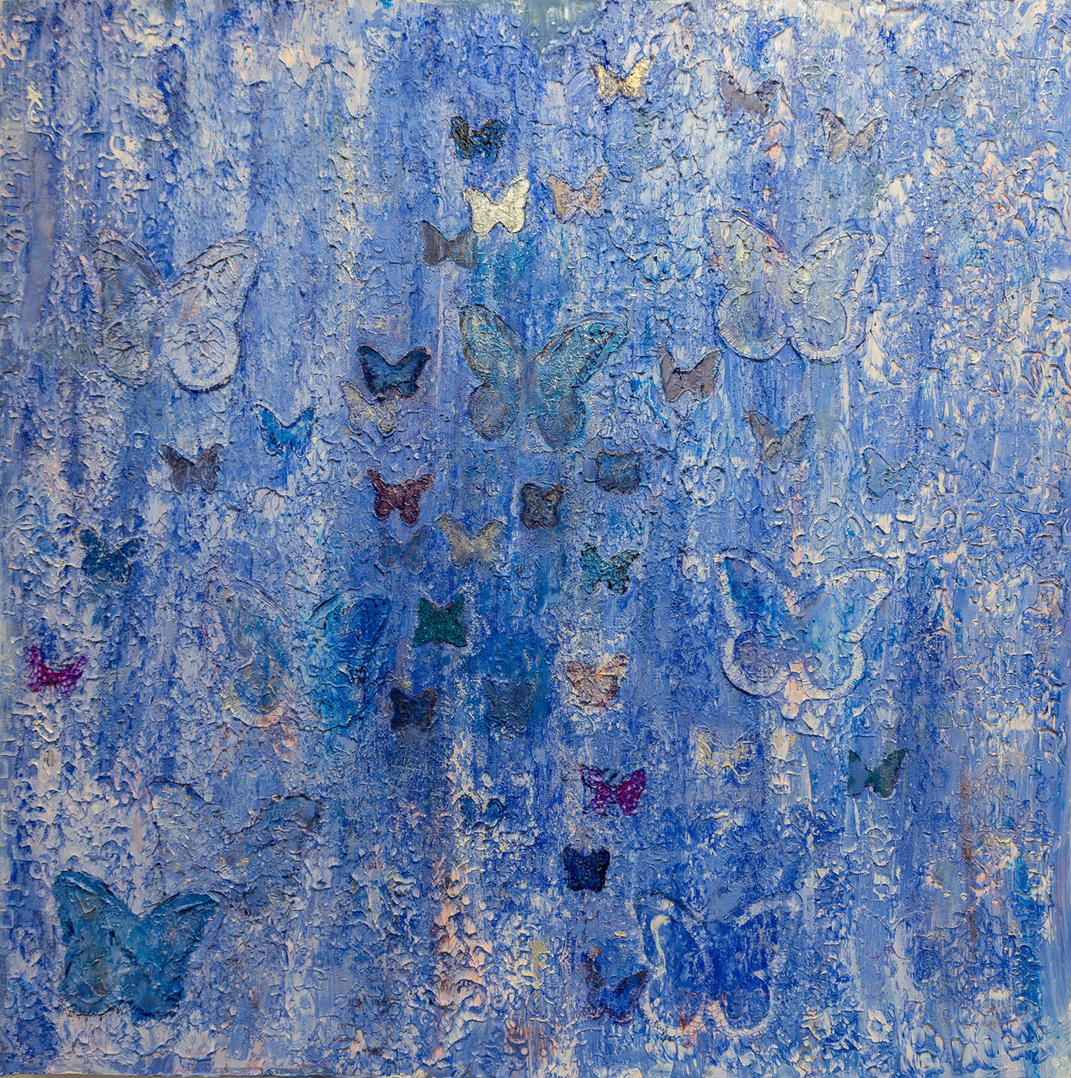 Square textured painting in cobalt and pale blue with scattered butterflies in teal, violet, navy and white. 