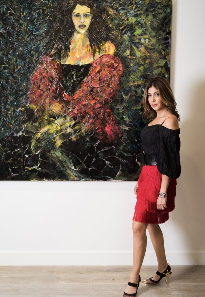 Haleh Mashian in front of her figurative artwork